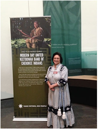 UKB Museum Director Ernestine Berry stands beside the History of the United Keetoowah Band Panel at the National Museum of the American Indian.